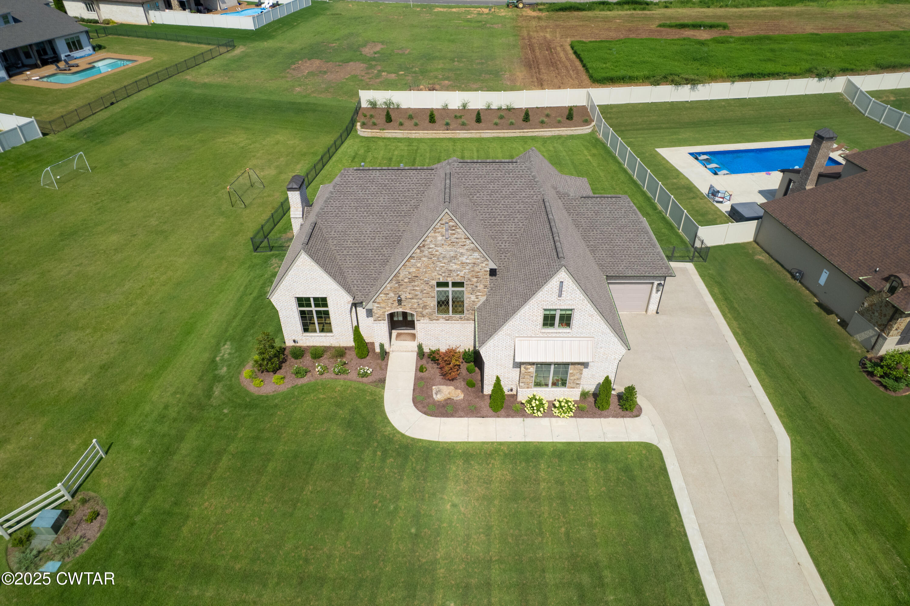 52 Buckingham Cove Jackson, TN 38305 - Photo 32 of 33 an aerial view of a house with a garden