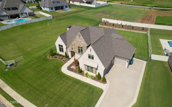an aerial view of a house with a garden