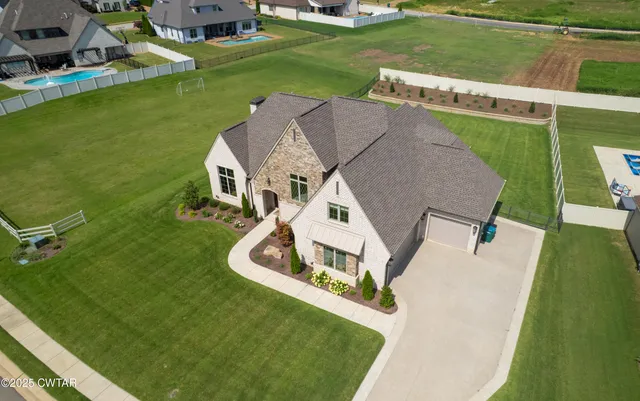 an aerial view of a house with a garden