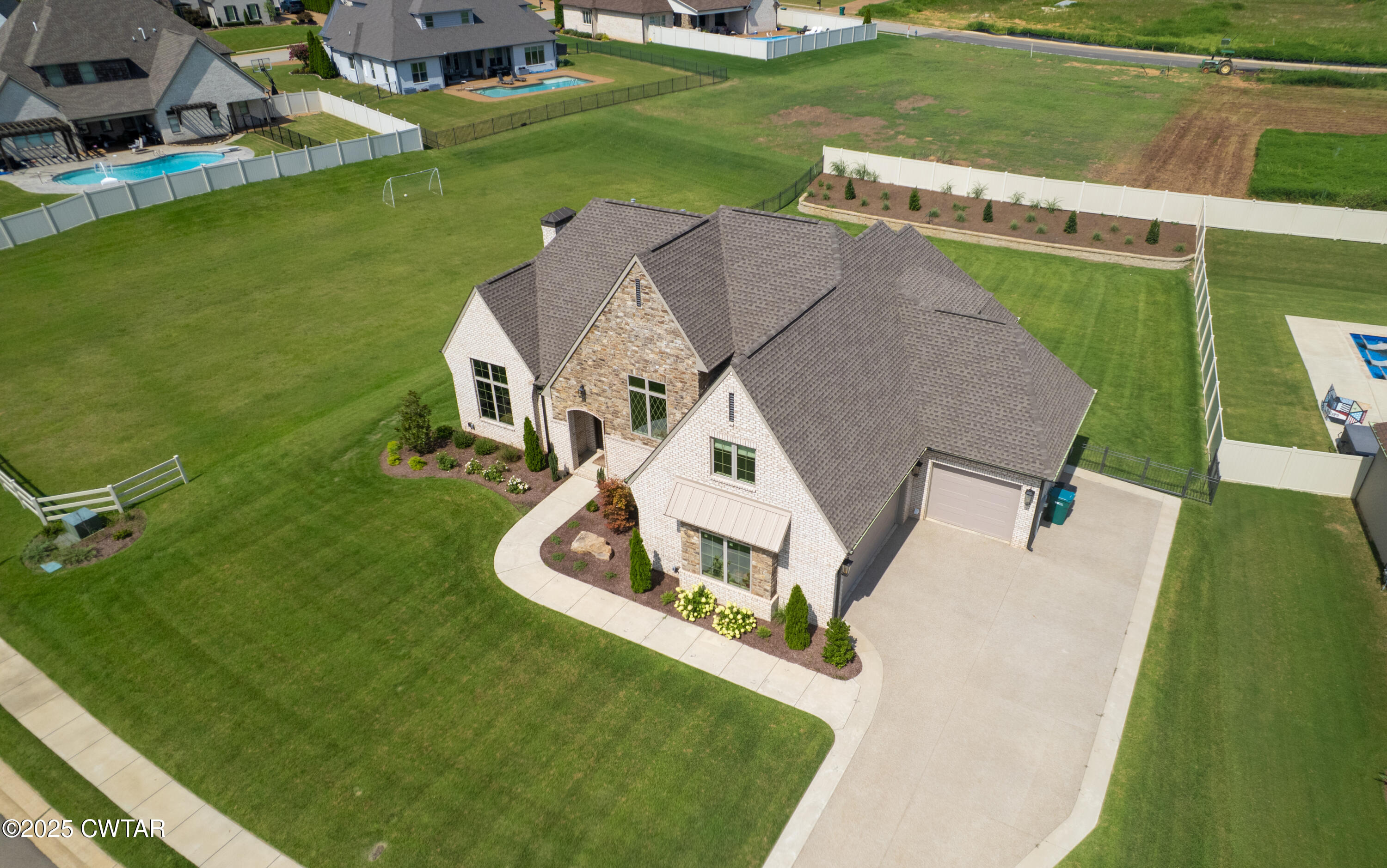 52 Buckingham Cove Jackson, TN 38305 - Photo 5 of 33 an aerial view of a house with a garden