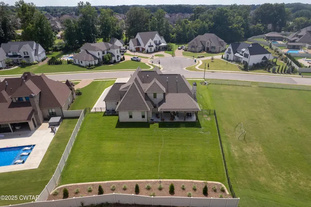 a view of swimming pool with a patio