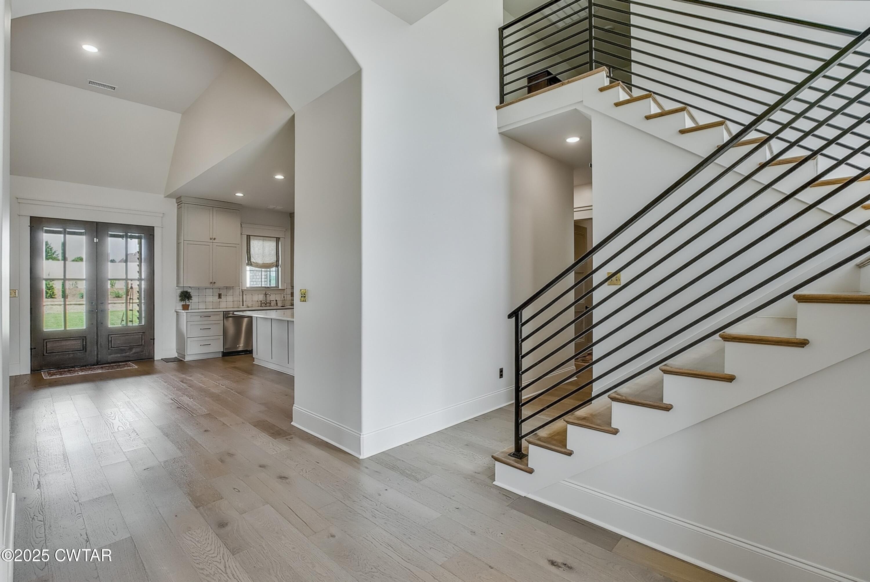 52 Buckingham Cove Jackson, TN 38305 - Photo 10 of 33 an entryway in a hall with a window and wooden floor