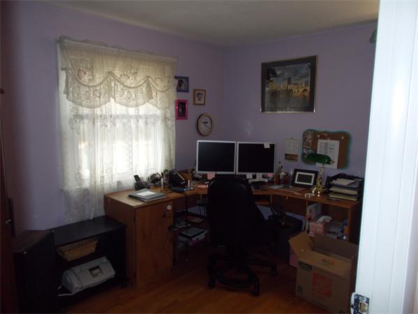 194 Peekskill Avenue Springfield, MA 01129 - Photo 10 of 16 a view of a workspace with furniture and a window