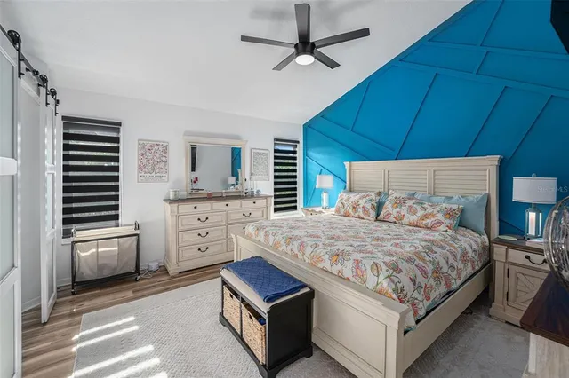 a bedroom with a bed and a dresser