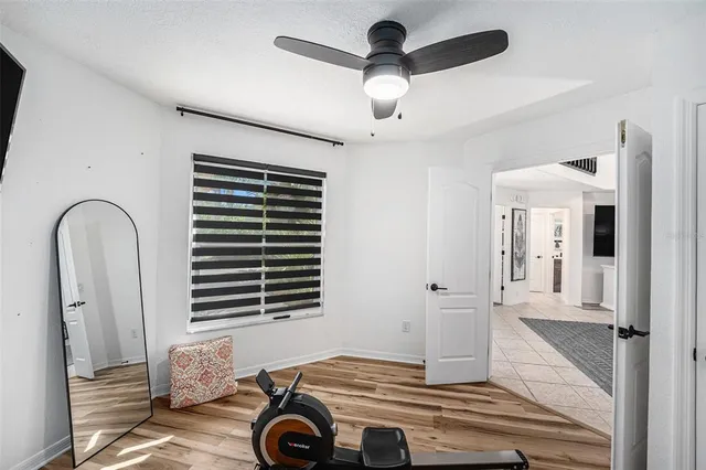 a room with window and ceiling fan