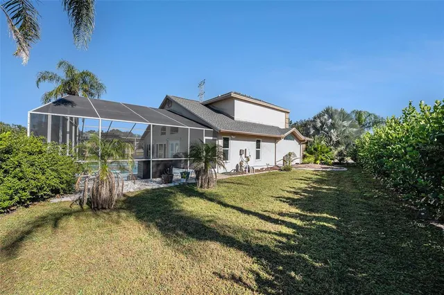 a front view of a house with a yard table and chairs
