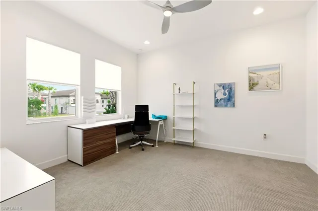 a view of workspace with furniture and a window