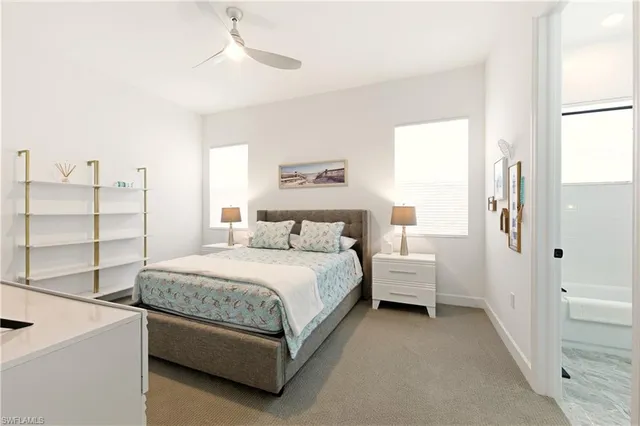 a spacious bedroom with a bed and a cabinets
