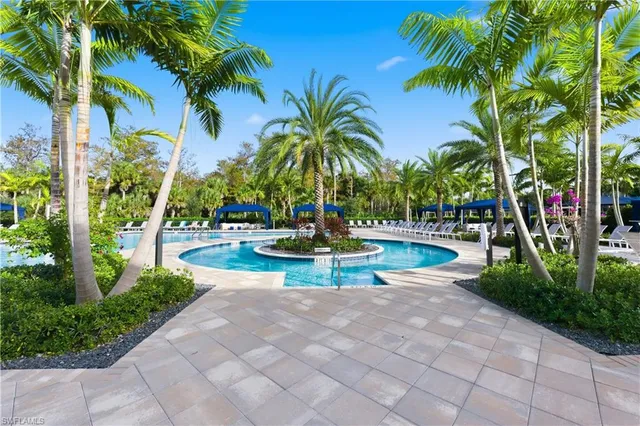 a view of a swimming pool with a patio