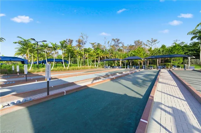 a view of a swimming pool with a bench