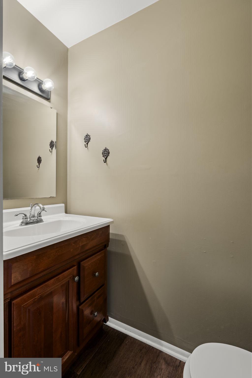 3 Dutton Court York, PA 17402 - Photo 12 of 30 a bathroom with a sink a toilet and mirror