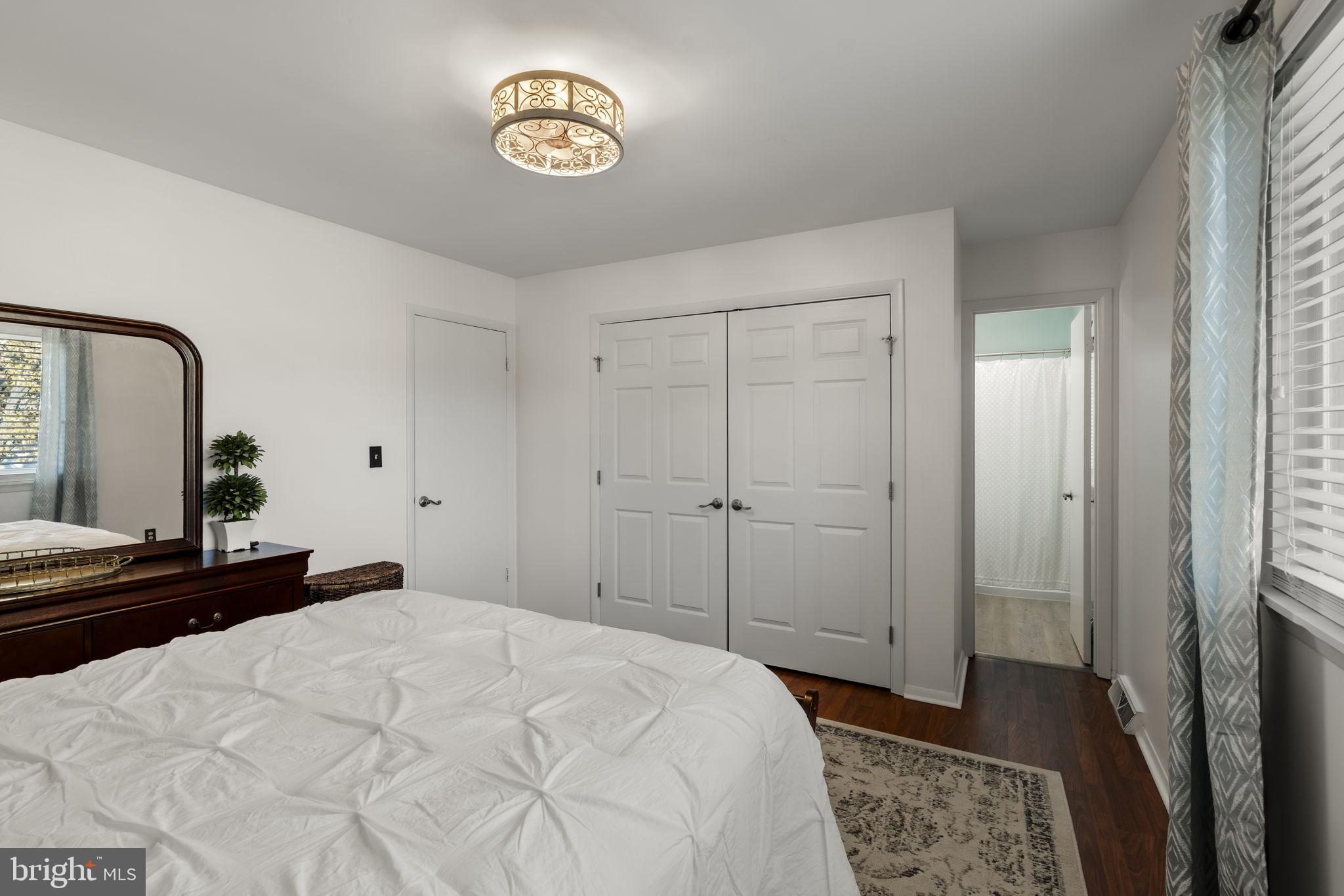 3 Dutton Court York, PA 17402 - Photo 14 of 30 a bedroom with a bed and a chandelier