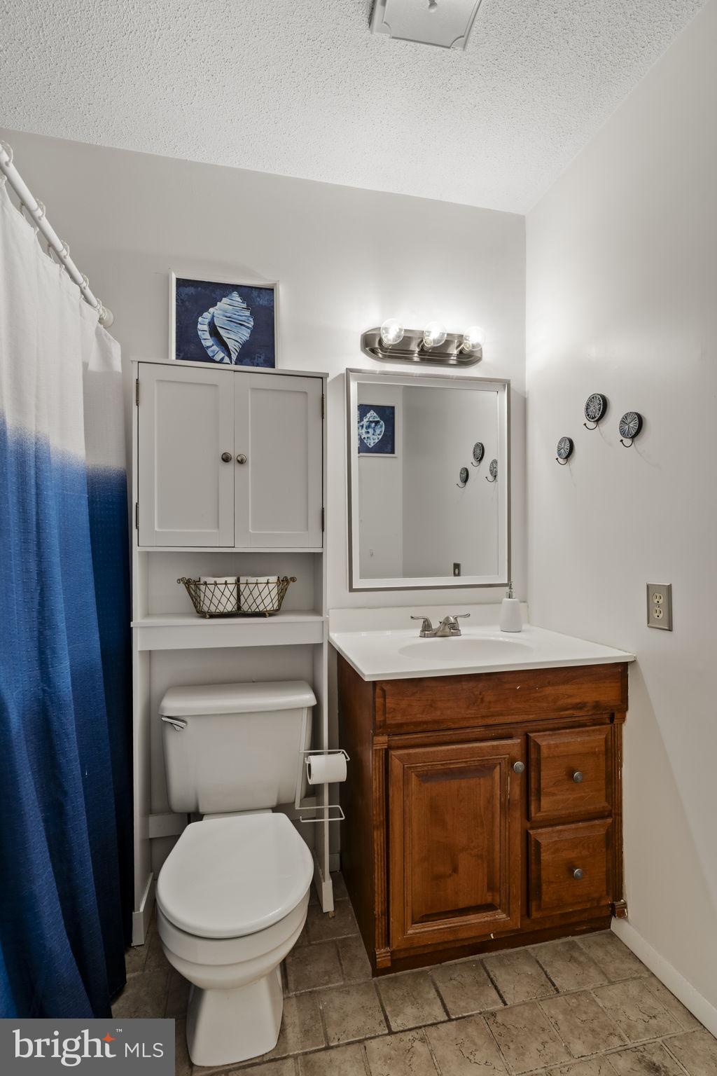 3 Dutton Court York, PA 17402 - Photo 18 of 30 a bathroom with a granite countertop toilet sink and mirror