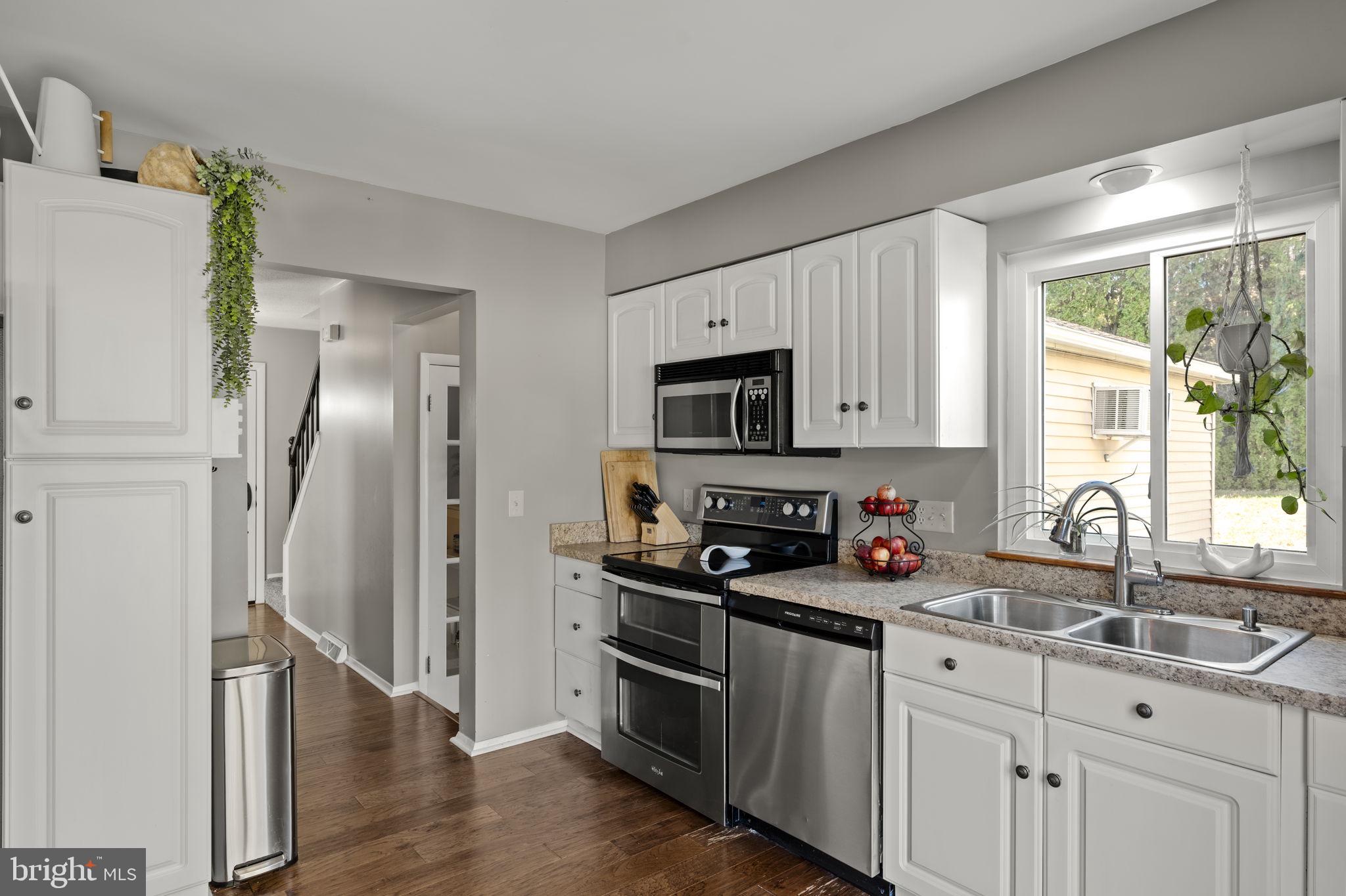 3 Dutton Court York, PA 17402 - Photo 4 of 30 a kitchen with stainless steel appliances a refrigerator sink and microwave