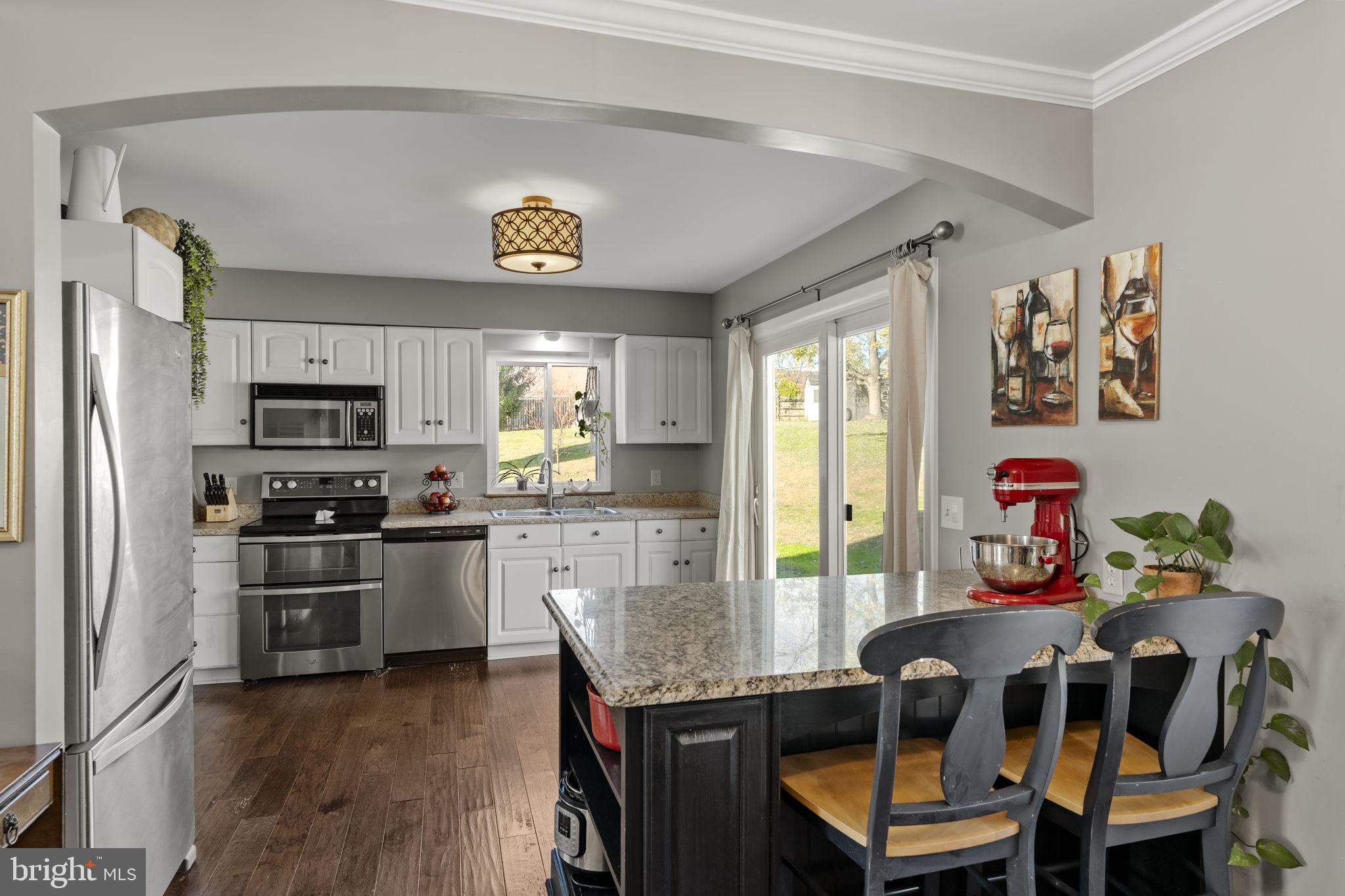 3 Dutton Court York, PA 17402 - Photo 6 of 30 a view of a kitchen with microwave and refrigerator