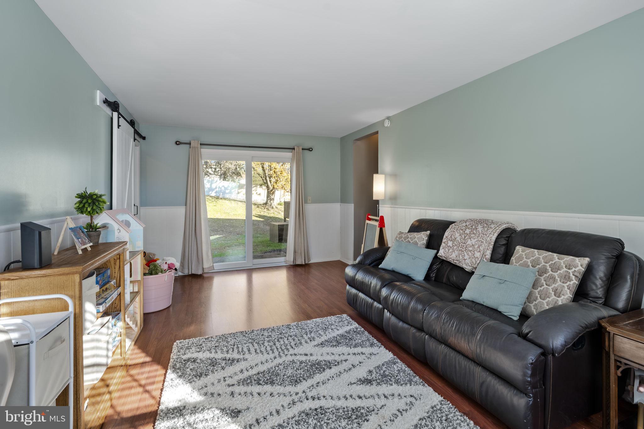 3 Dutton Court York, PA 17402 - Photo 10 of 30 a living room with furniture and a large window