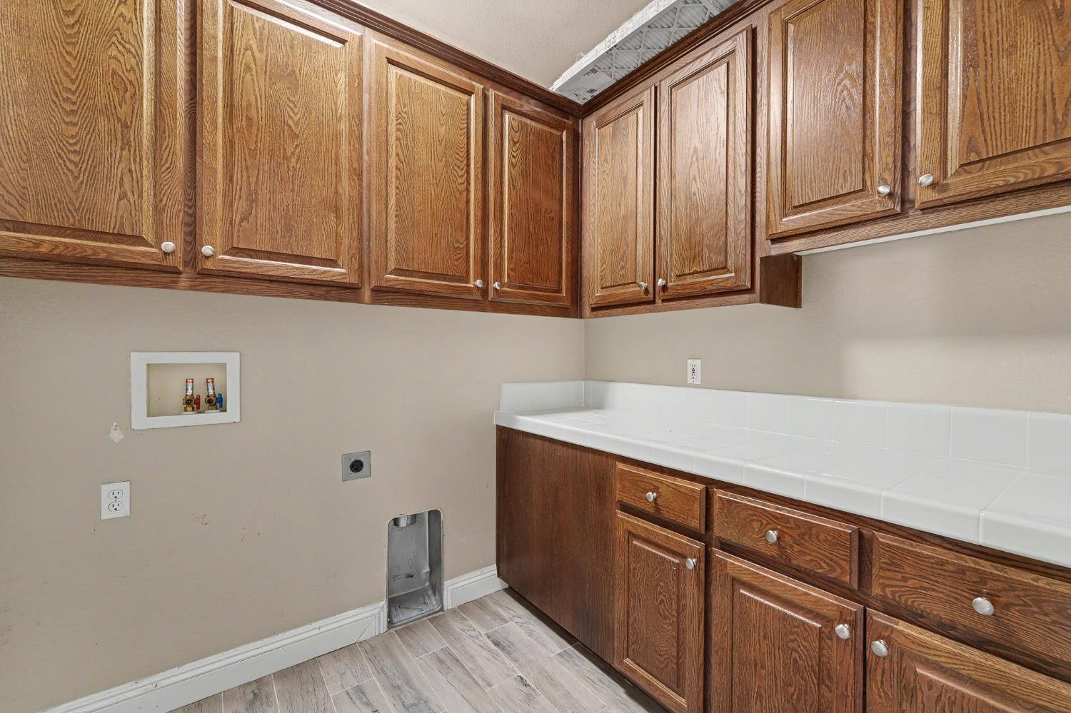 1223 East Springer Drive Turlock, CA 95382 - Photo 38 of 48 a view of cabinets with wooden floor