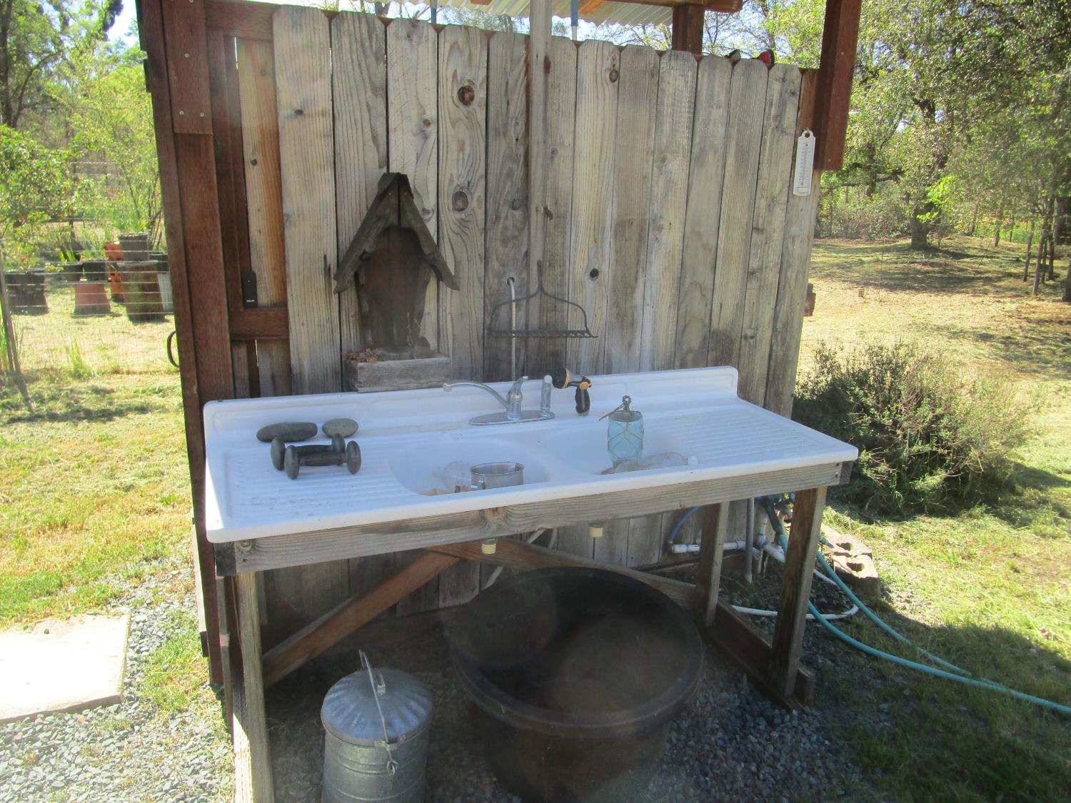 10410 Valley Drive Rough and Ready, CA 95975 - Photo 11 of 31 a bathroom with a sink and a mirror