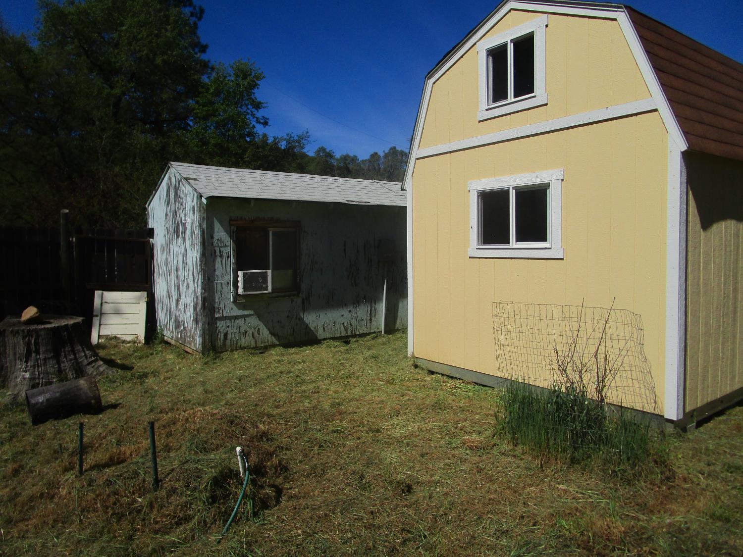 10410 Valley Drive Rough and Ready, CA 95975 - Photo 17 of 31 a view of a house with backyard and garden