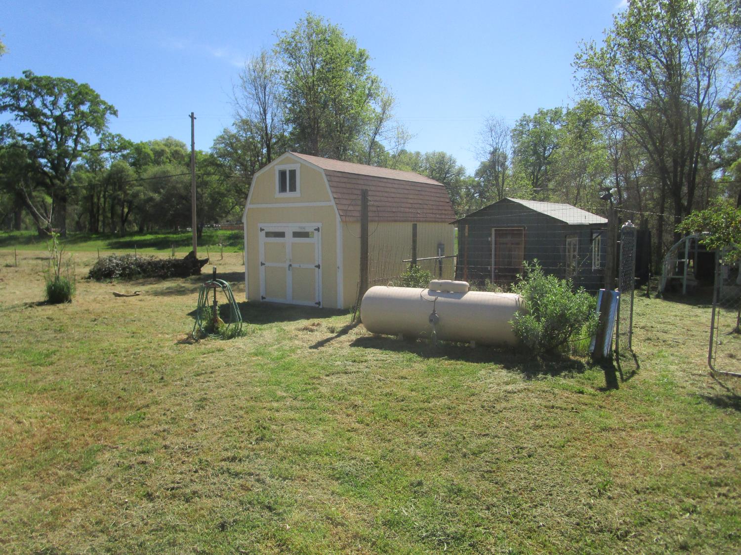 10410 Valley Drive Rough and Ready, CA 95975 - Photo 9 of 31 a backyard of a house with yard and outdoor seating
