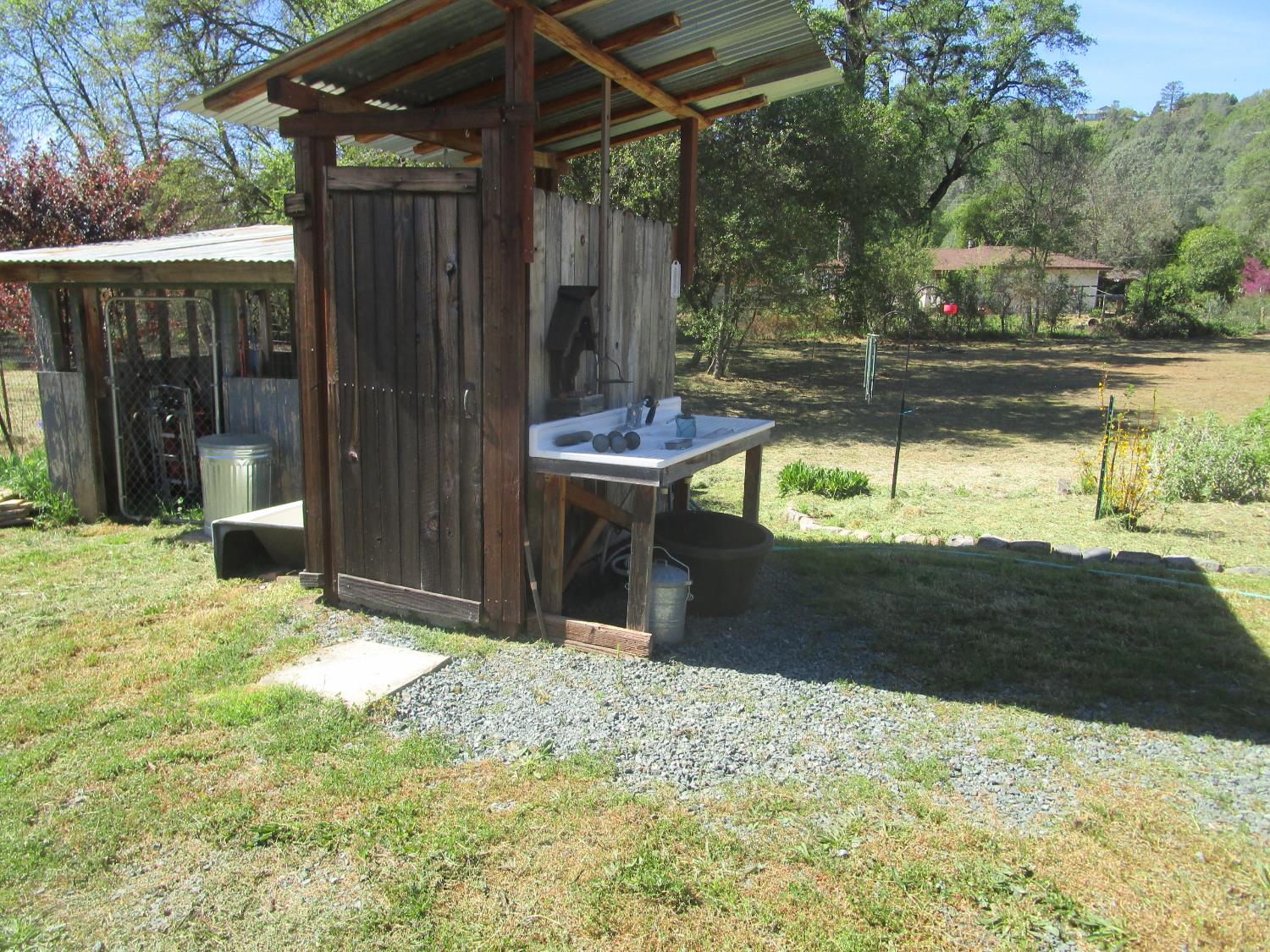 10410 Valley Drive Rough and Ready, CA 95975 - Photo 10 of 31 a view of a backyard with a small cabin