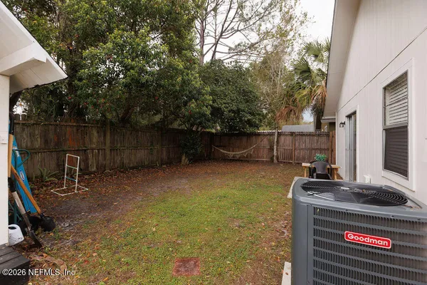 a view of a backyard with sitting area