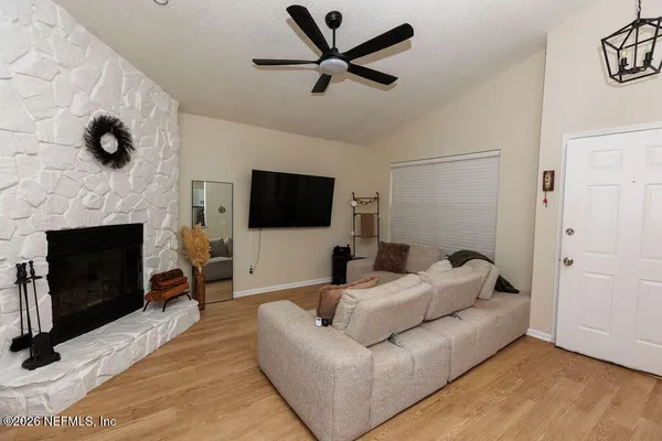 a living room with furniture and a flat screen tv