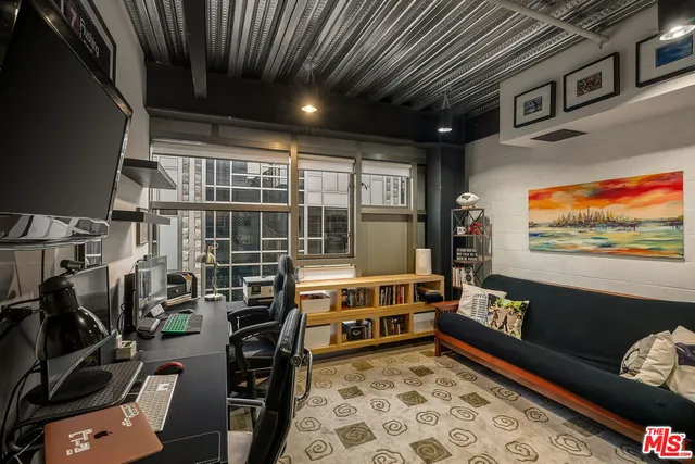 a room with furniture and a flat screen tv