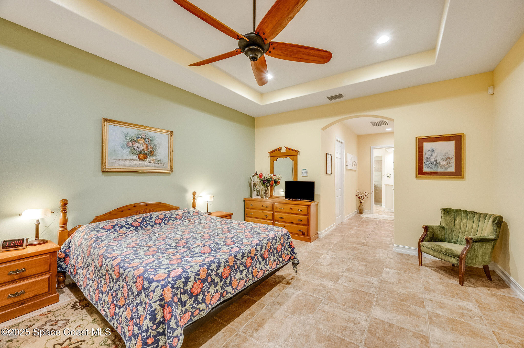 2800 Parrish Road Titusville, FL 32796 - Photo 22 of 45 a bedroom with a bed and a chandelier