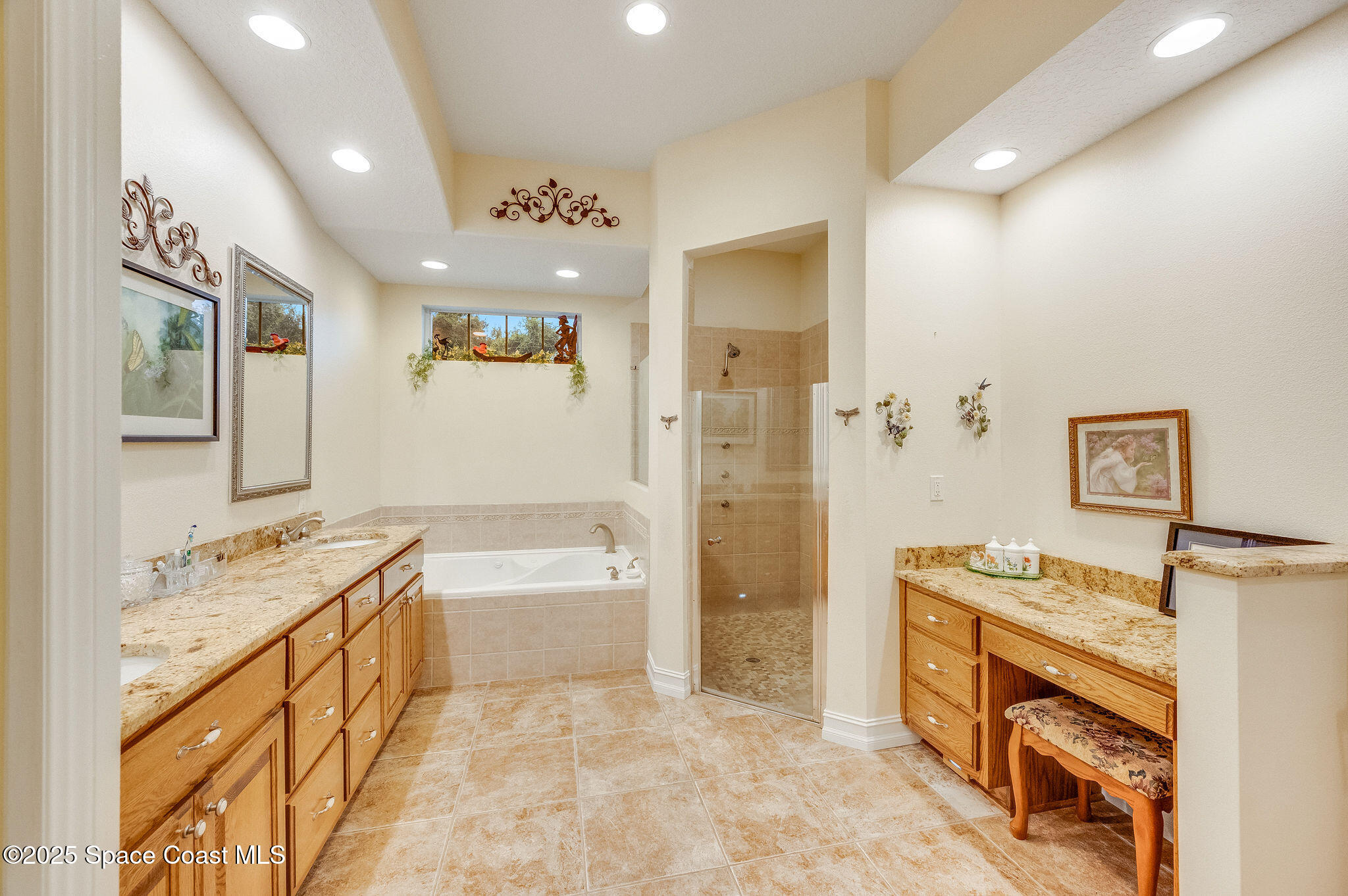 2800 Parrish Road Titusville, FL 32796 - Photo 23 of 45 a spacious bathroom with a tub sink and mirror