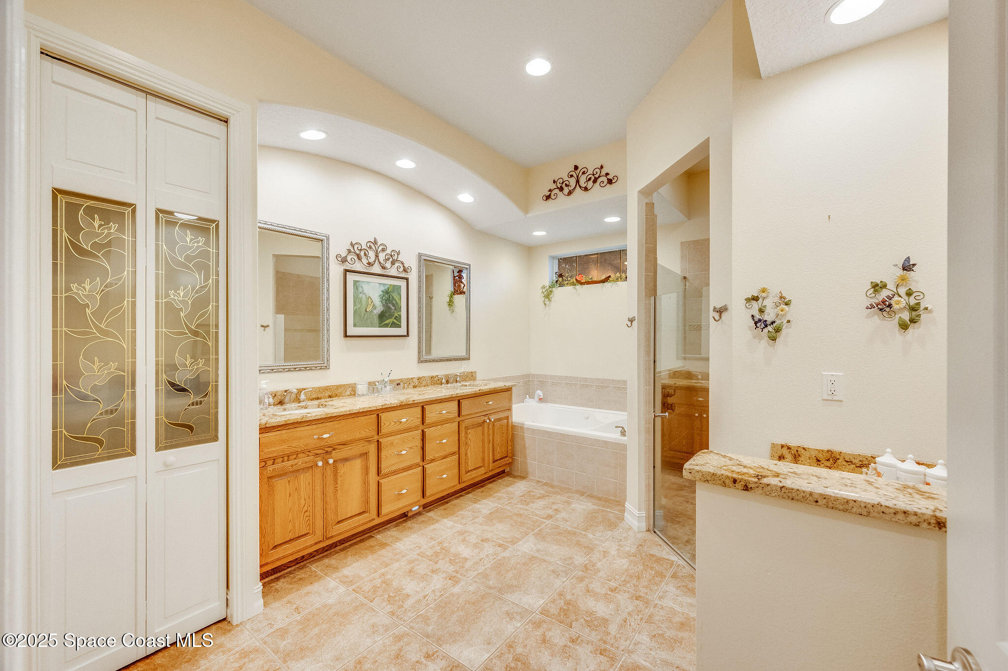 2800 Parrish Road Titusville, FL 32796 - Photo 25 of 45 a large bathroom with a tub sink and mirror