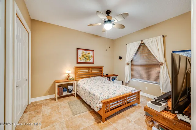 a bedroom with a bed and a book shelf