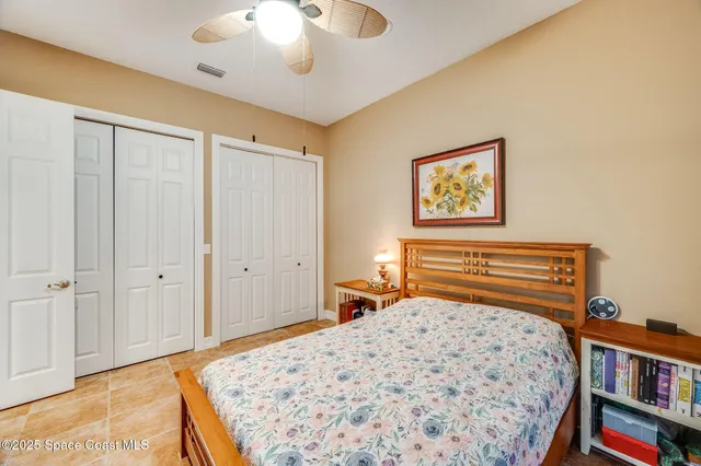 a bathroom with a granite countertop sink toilet a mirror and shower