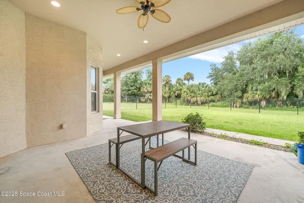 a sitting area with furniture and garden view