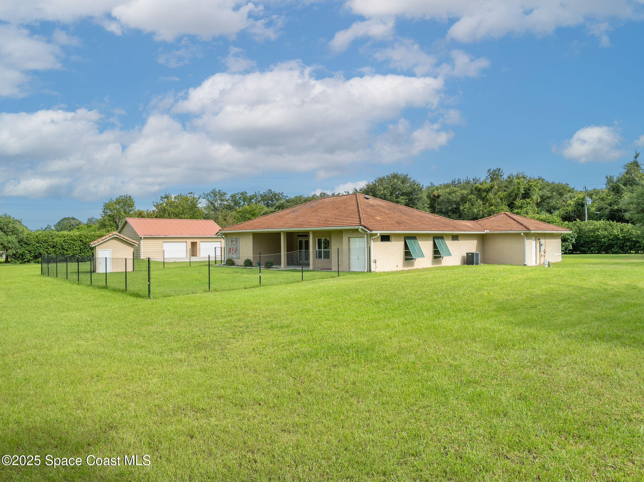 2800 Parrish Road Titusville, FL 32796 - Photo 37 of 45 a front view of a house with a garden
