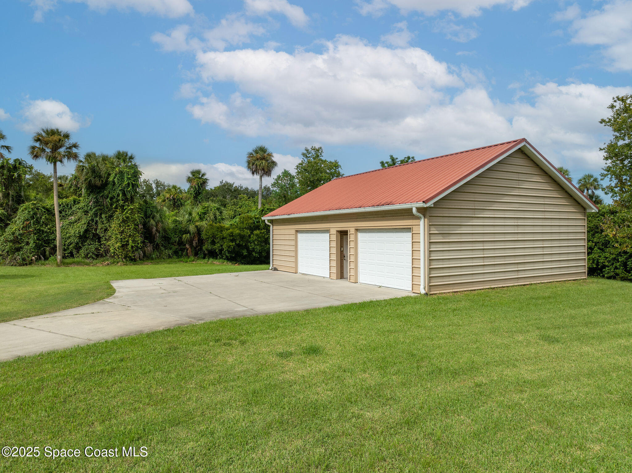 2800 Parrish Road Titusville, FL 32796 - Photo 39 of 45 a view of a house with a yard