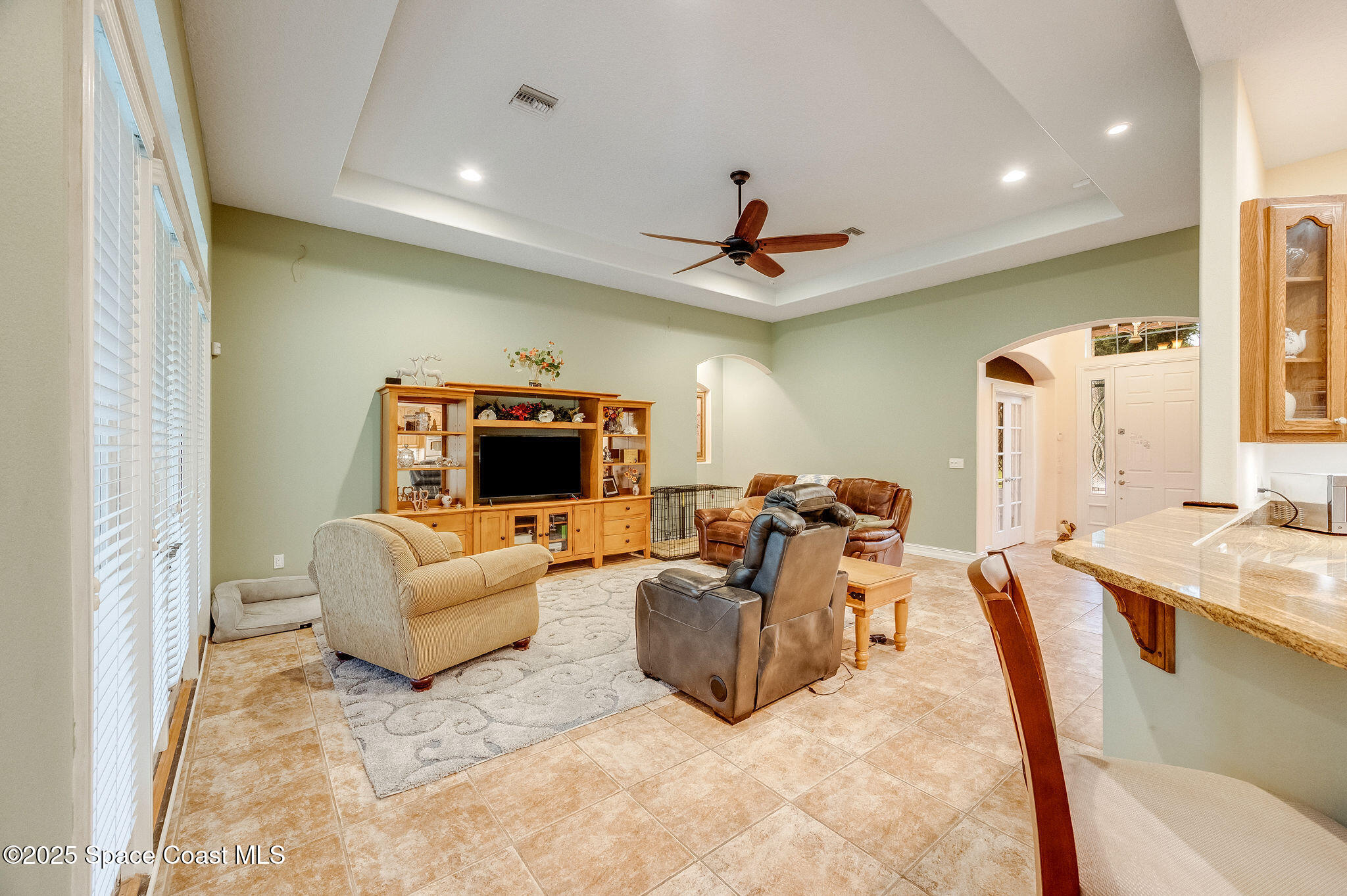 2800 Parrish Road Titusville, FL 32796 - Photo 6 of 45 a living room with furniture and a flat screen tv