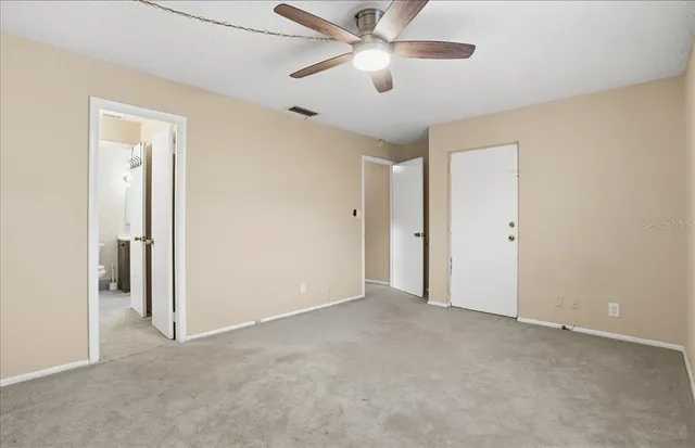 a bathroom with a sink a toilet a mirror and shower