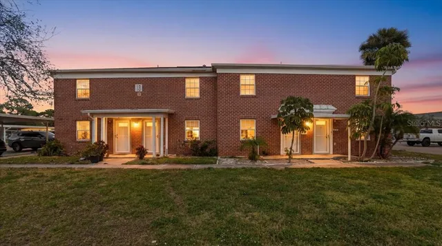 a brick building with a yard