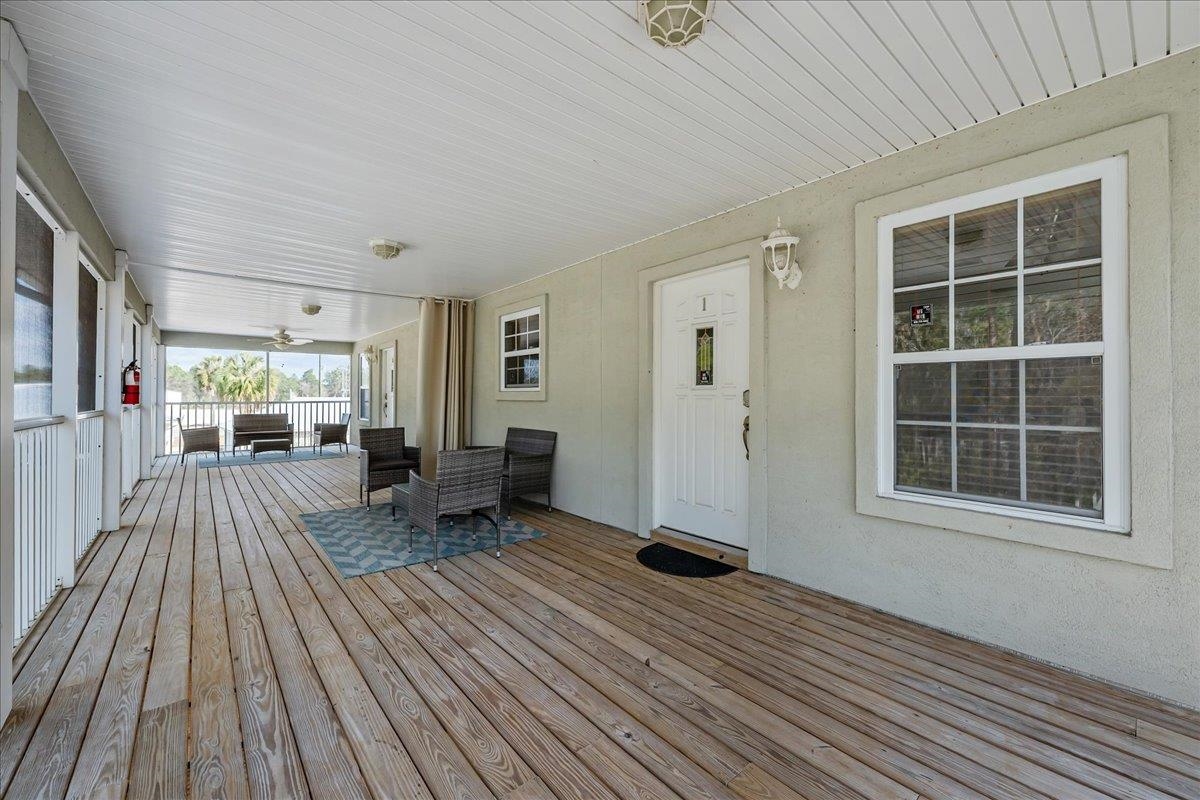 736-8 Kings Estate Road St. Augustine, FL 32086 - Photo 17 of 40 Wooden deck with an outdoor living space