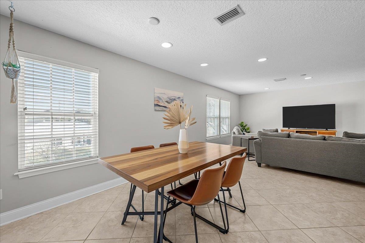 736-8 Kings Estate Road St. Augustine, FL 32086 - Photo 19 of 40 Dining area featuring light tile patterned floors, a textured ceiling, and recessed lighting