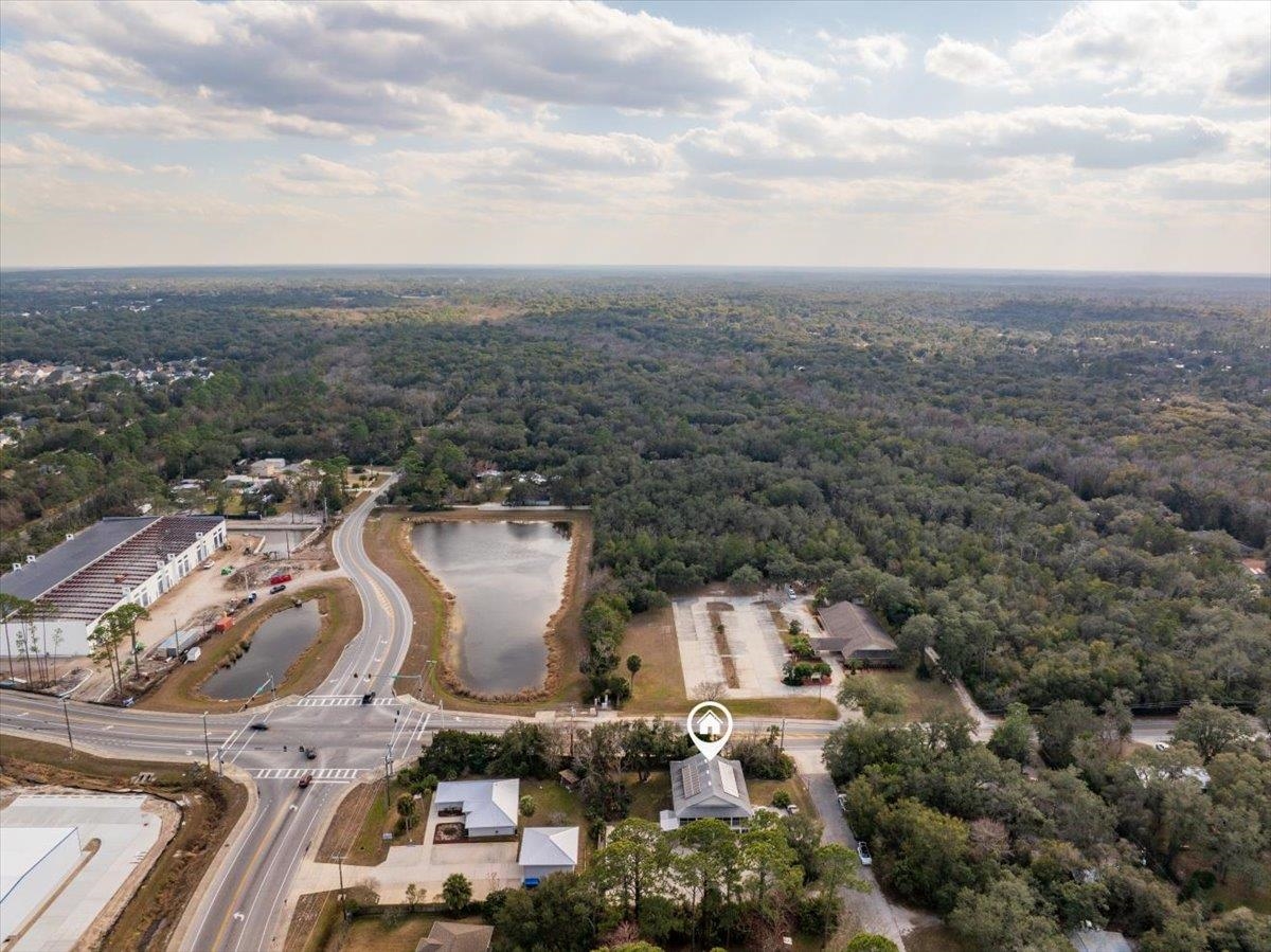 736-8 Kings Estate Road St. Augustine, FL 32086 - Photo 33 of 40 Aerial overview of property's location featuring a forest and a large body of water