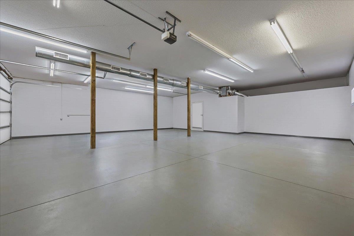 736-8 Kings Estate Road St. Augustine, FL 32086 - Photo 9 of 40 Garage featuring a garage door opener