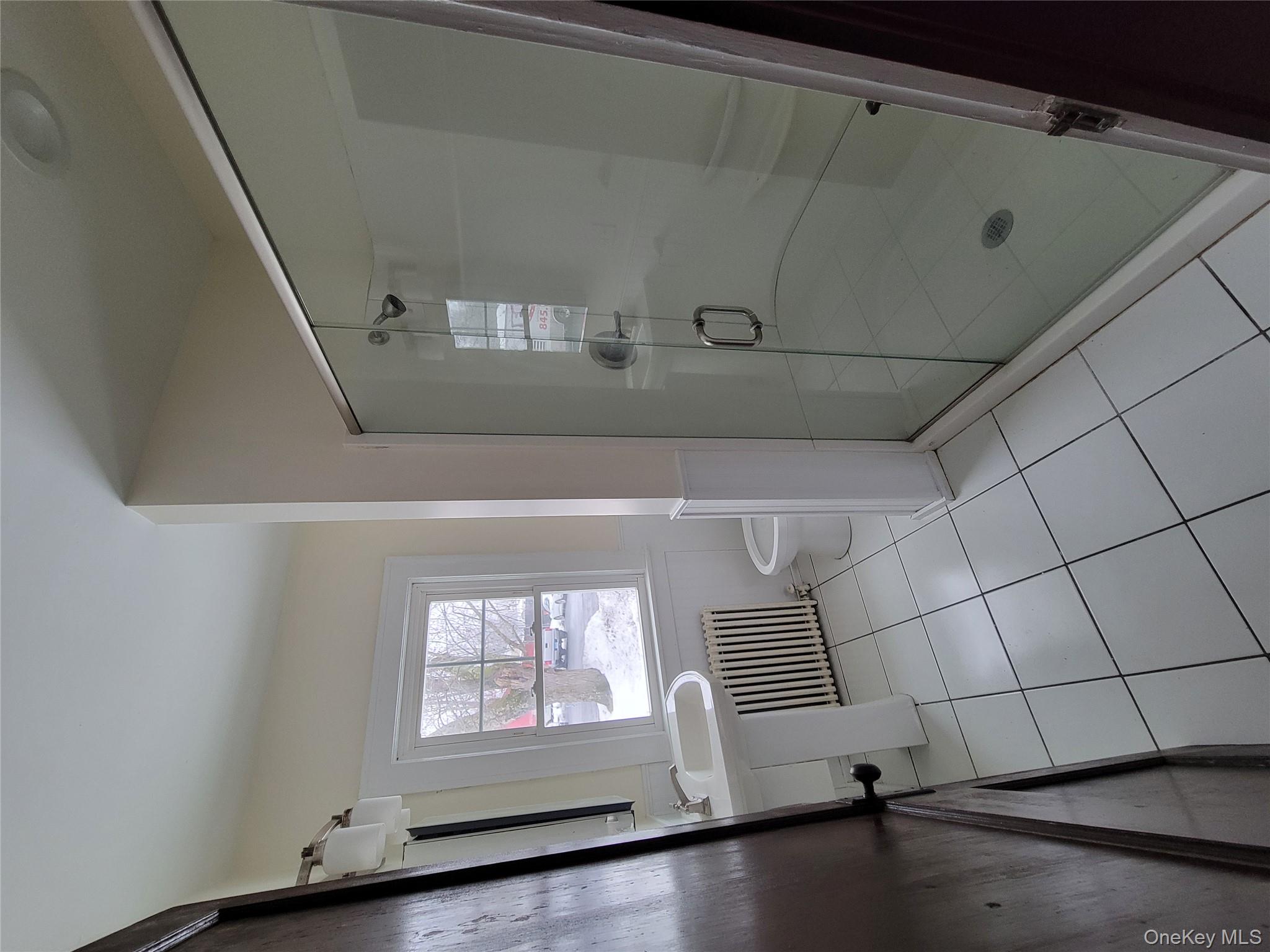 712 State Route 52 Walden, NY 12586 - Photo 15 of 21 a bathroom with a shower and toilet