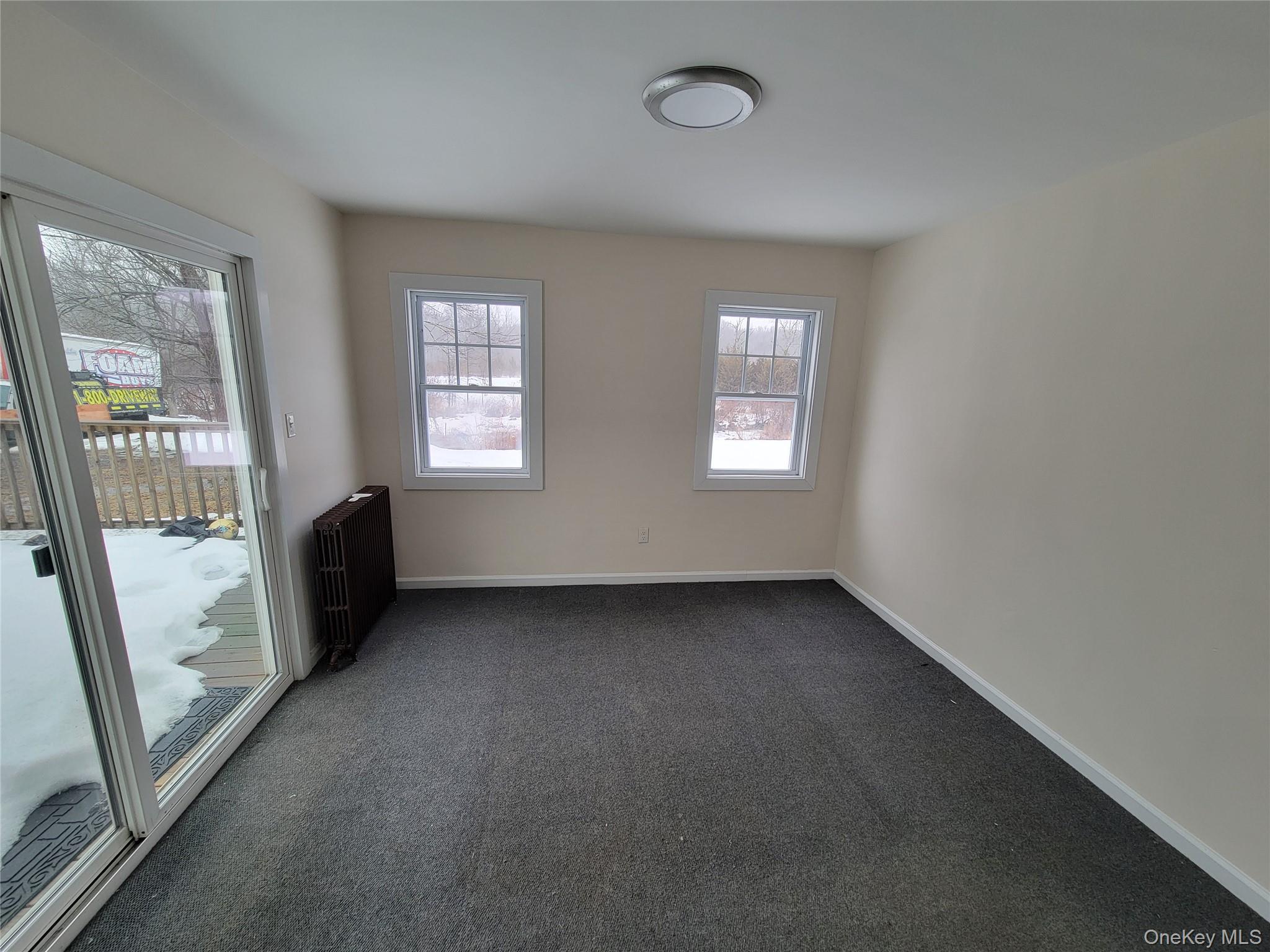 712 State Route 52 Walden, NY 12586 - Photo 19 of 21 an empty room with windows