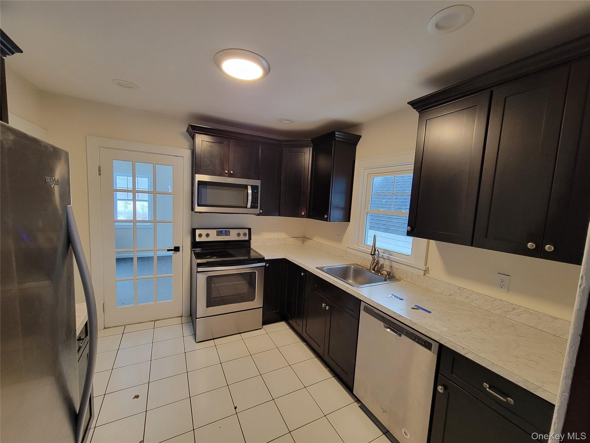 712 State Route 52 Walden, NY 12586 - Photo 5 of 21 a kitchen with stainless steel appliances granite countertop a refrigerator and a stove top oven