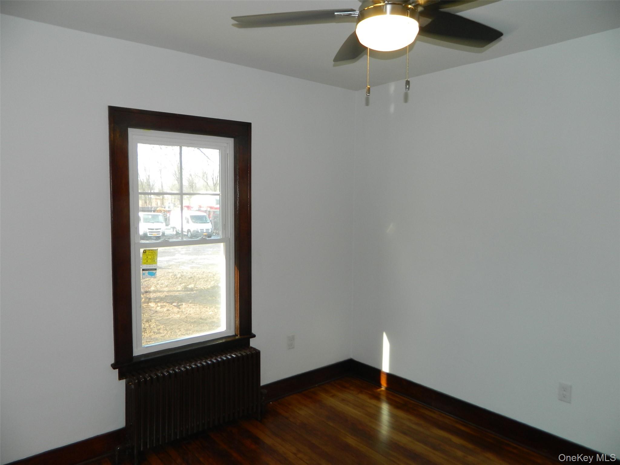 712 State Route 52 Walden, NY 12586 - Photo 10 of 21 a room with wooden floor and a window