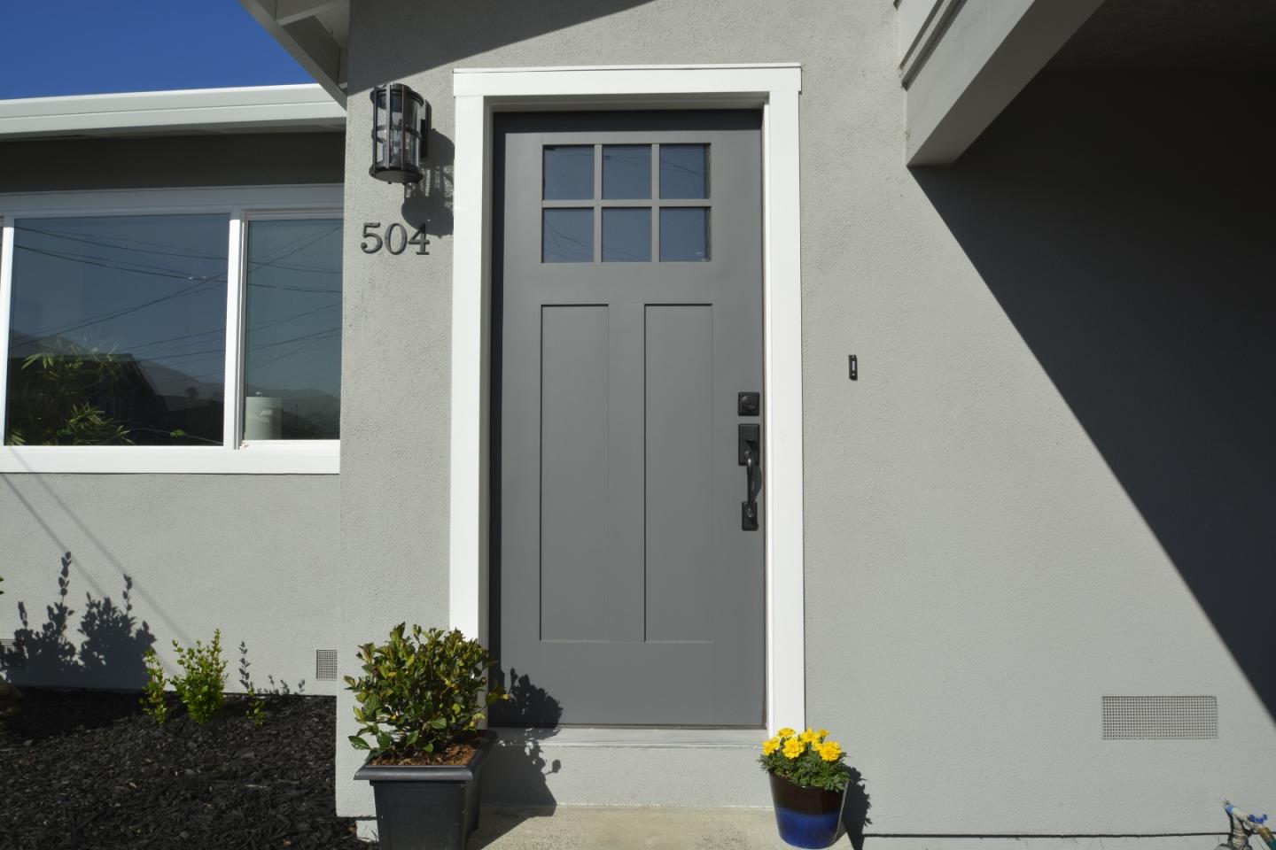 504 Arguello Boulevard Pacifica, CA 94044 - Photo 2 of 42 a front view of a house with a yard