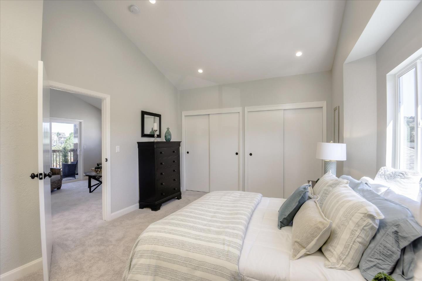 504 Arguello Boulevard Pacifica, CA 94044 - Photo 21 of 42 a bedroom with a bed and a table