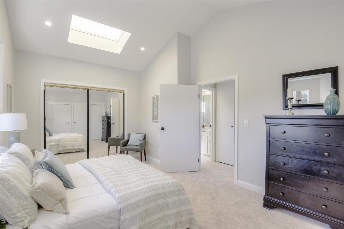 504 Arguello Boulevard Pacifica, CA 94044 - Photo 22 of 42 a bedroom with a bed and a mirror